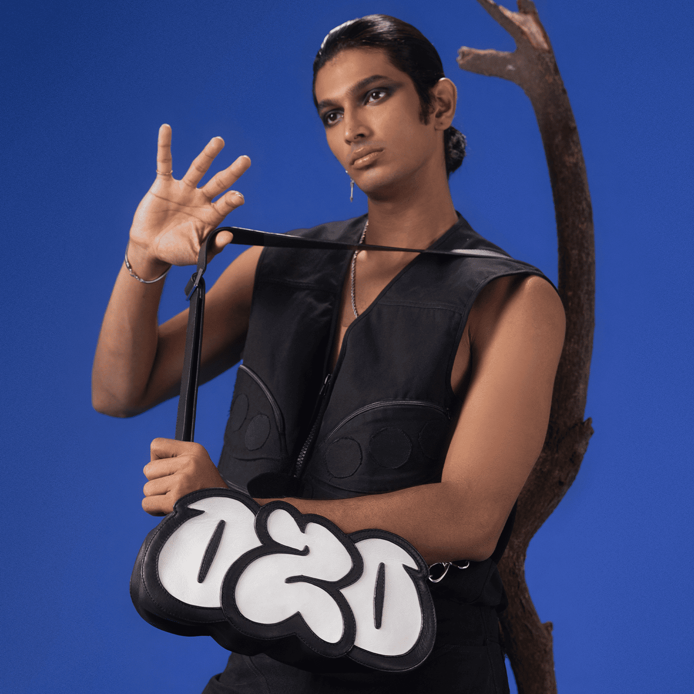 Model wearing Ozo 'Sage' graffiti bag, front view